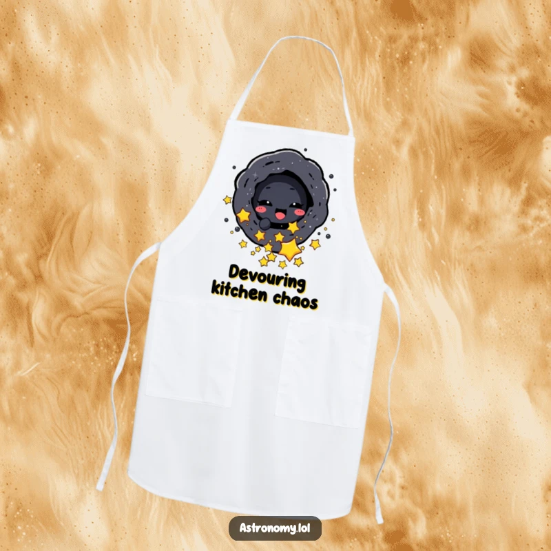 Funny apron depicting a black hole character playfully consuming small stars, ready for any kitchen endeavor.