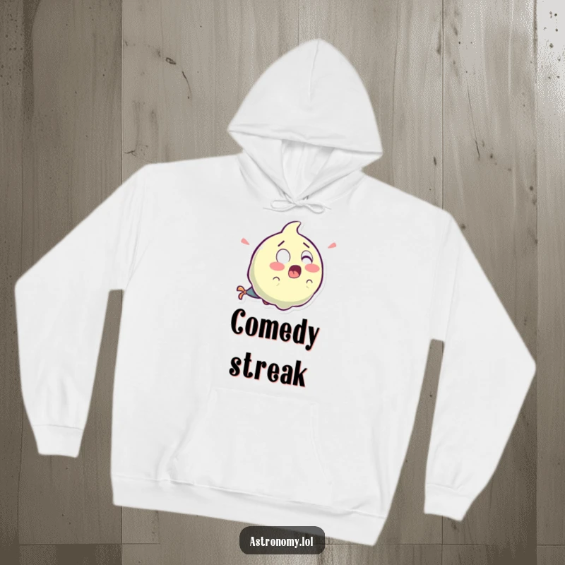 Funny surprised comet character with a laughter tail, providing warmth and humor on a cozy hoodie.