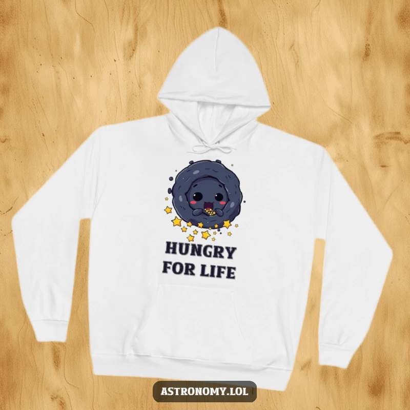 Funny Hoodie: A Mischievous Black Hole Character Absorbing Stars, offering cozy comfort and a darkly humorous design. An excellent present.