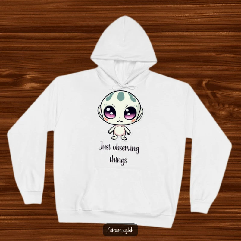 Funny hoodie featuring a surprised alien with large, wide eyes, offering warmth and a touch of extraterrestrial humor.
