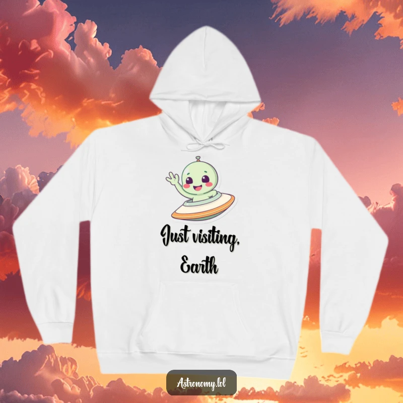 Funny alien hoodie featuring a smiling extraterrestrial waving cheerfully from inside a detailed spaceship design.