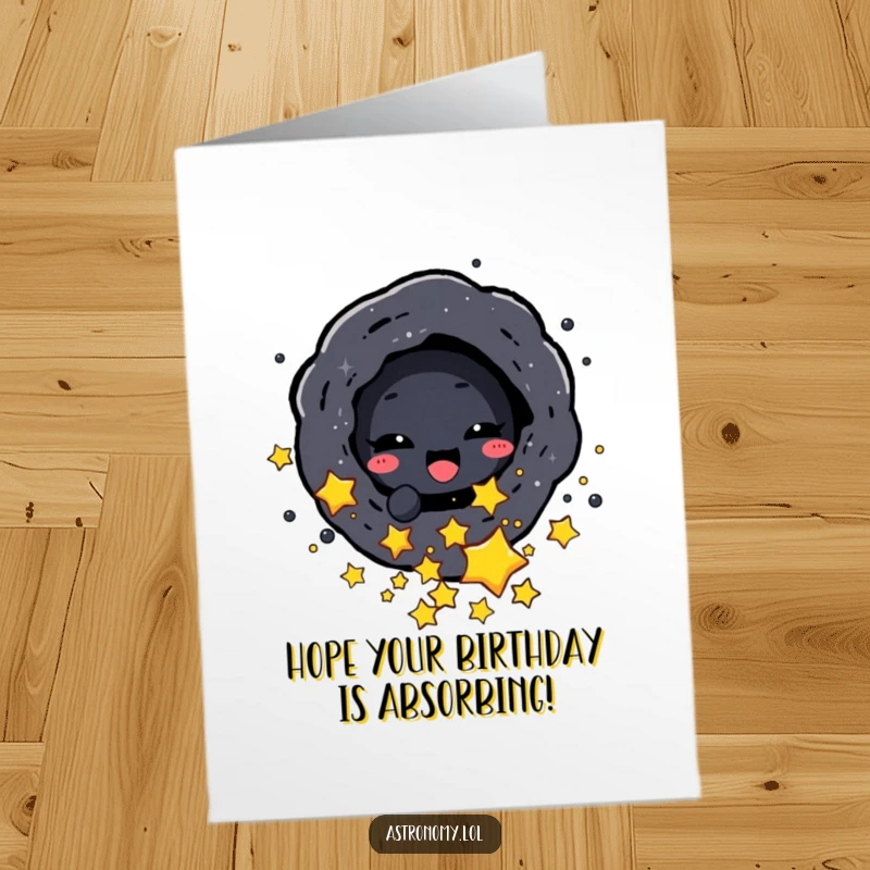 Funny Free Printable Birthday Card: Delighted black hole character playfully sucking in small stars, a downloadable birthday surprise.