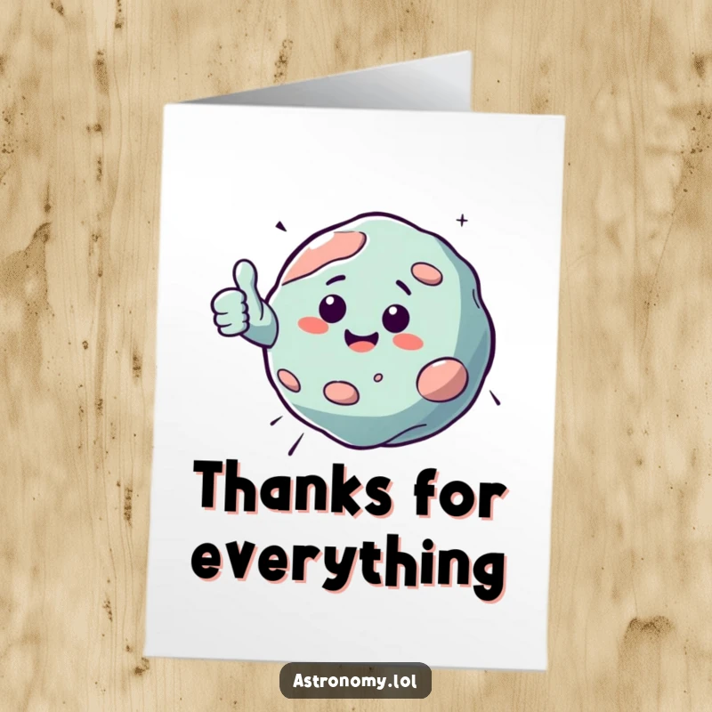Funny free printable thank you card featuring a cheerfully bouncing asteroid giving a thumbs up, conveying cosmic thanks with interstellar humor.