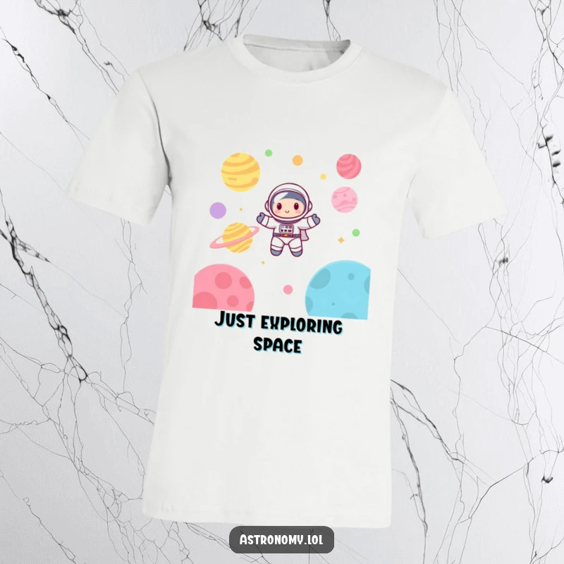 Funny astronaut t-shirt featuring a cute, happy character floating joyfully among colorful planets in a cartoonish space scene.