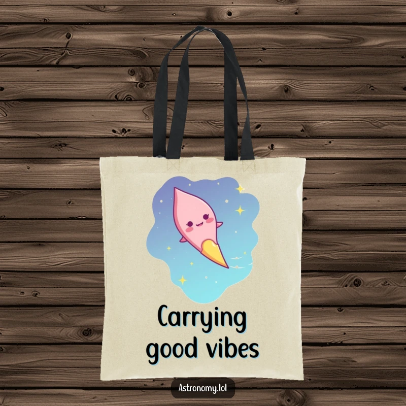 Funny giggling comet tote bag with a smiling face streaking across the sky, a humorous and practical gift.
