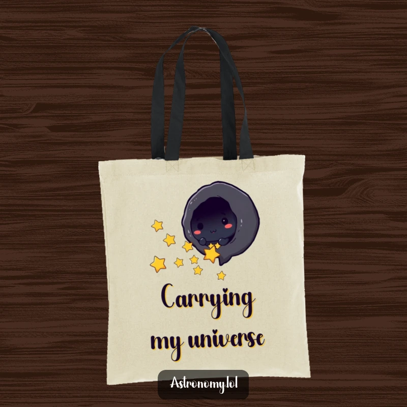 Funny black hole character playfully sucking in tiny stars on a durable tote bag, a humorous accessory.