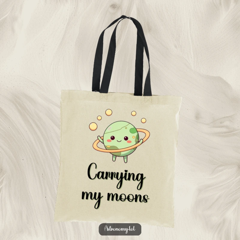 Funny planet tote bag showcasing a happy character juggling moons, a vibrant and humorous accessory for everyday use.